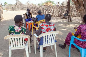 Local community members visit a UN-supported health worker in rural South Sudan, where access to healthcare remains a major challenge.
