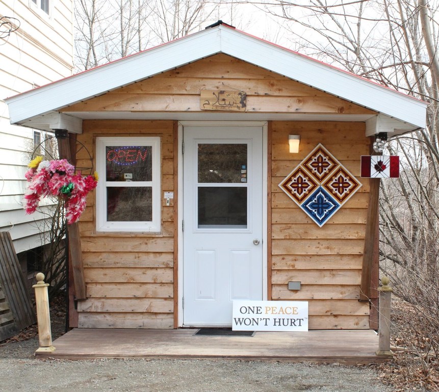 The original factory shed built by members of the community and located on the family’s property next to their home. The original factory shed built by members of the community and located on the family’s property next to their home.