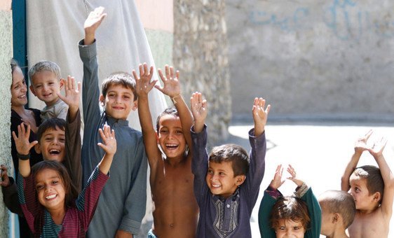 Afghan children show their fingers marked to indicate they have been vaccinated against polio.