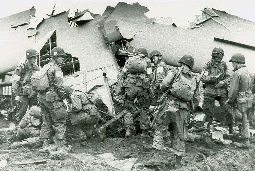 US troops that landed behind German lines in Holland examine what is left of a glider damaged during the airborne operation. Photo Courtesy of US Army